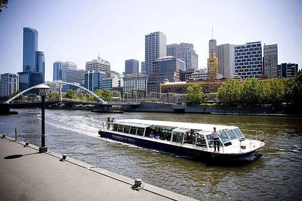 Cruise boat sails on the Yarra River in Southbank