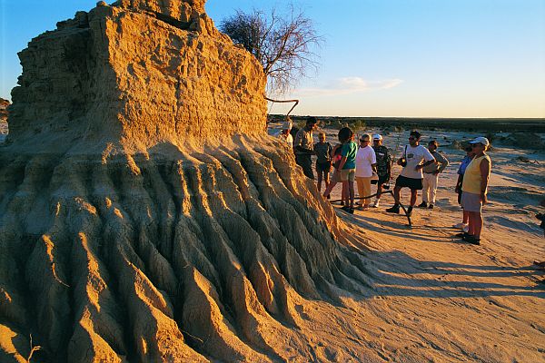 Tourists examine termite hill at Mungo National Park